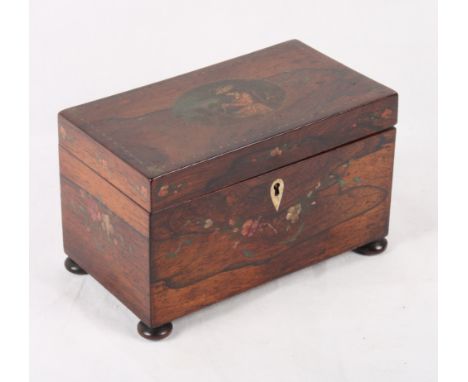 An early 19th Century rosewood two-division tea caddy with painted decoration of a girl seated at her work, on ball feet, 8" 