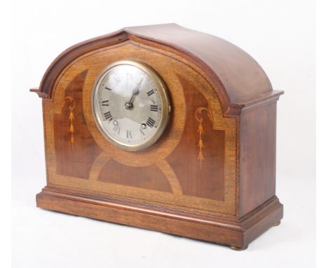 An early 20th Century walnut and inlaid mantel clock with silvered dial, 11" high