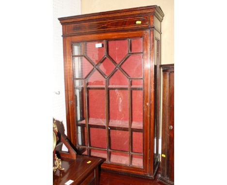 An Edwardian mahogany and line inlaid wall hanging cabinet enclosed lattice glazed panel door, 24" wide