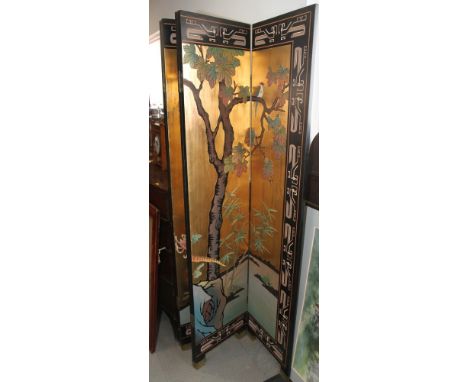 A modern Chinese six-fold draught screen decorated birds and foliage on a gold ground, each panel 16" x 72" high