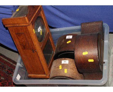 Three oak cased dome top mantel clocks and an oak cased wall clock