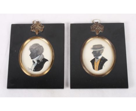 An oval pen and ink silhouette portrait of an early 19th Century gentleman and a similar portrait of an early 20th Century ge