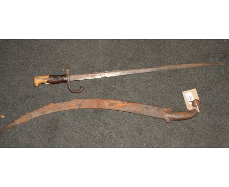 A Martini Henry action rifle, a pair of Eastern swords with curved blades, a sword stick (lacking sheath) and a 19th Century 