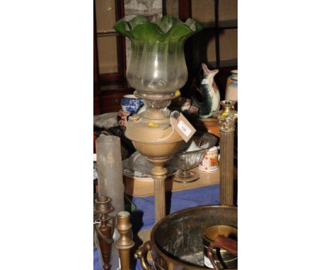 A brass oil lamp with reeded stem, green glass shade and chimney, 30" high overall