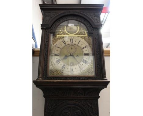 18th century longcase clock with eight day movement, brass break arch dial, pierced brass face mask spandrels, silvered chapt