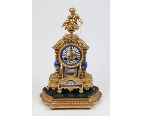 19th century French mantel clock with eight day movement, striking on a bell, porcelain dial with Roman numerals and central 