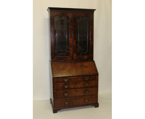 Good quality George III flame mahogany two height bureau bookcase with shelves above enclosed by two astragal glazed doors, c