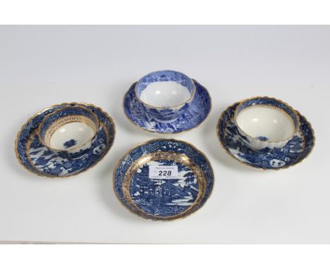 Two 18th century Caughley Salopian blue and white tea bowls and saucer, a further saucer, each with gilt rims and gilt scroll