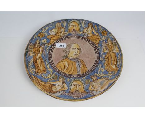 Late 19th / early 20th century Italian Majolica charger, with central panels painted with a portrait of a gentleman, the bord