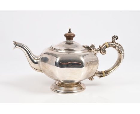 19th century Dutch silver bachelors teapot of compressed melon form, with faceted panels, decorative silver scroll handle wit