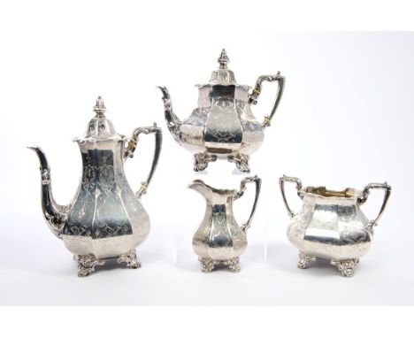 Victorian silver four piece tea set comprising teapot of faceted form, with engraved Gothic strapwork decoration, silver angu