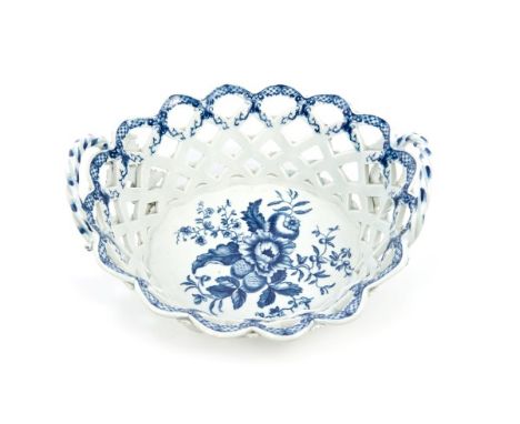 18th century Worcester porcelain chestnut basket, lattice pierced with flower-head, ropetwist handle, painted in the pine con