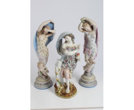 Pair of large French painted bisque figures, each modelled as standing female figures wearing diaphanous gowns, with winged c