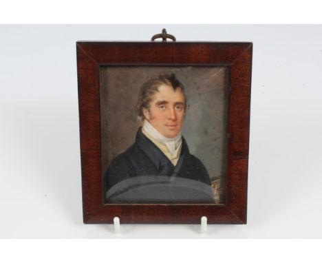 Early 19th century English School miniature on ivory - portrait of a handsome young gentleman wearing a black coat and white 