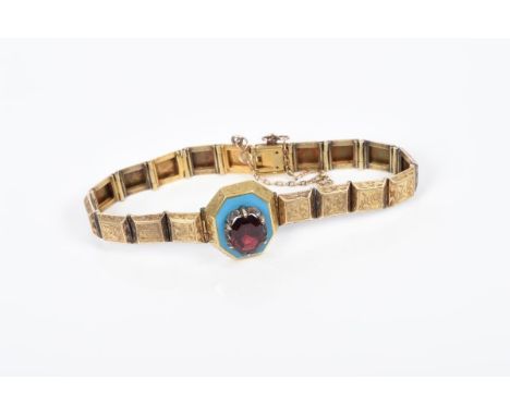 Victorian yellow metal bracelet, the central octagonal panel with an octagonal step cut garnet mounted on a turquoise enamel 