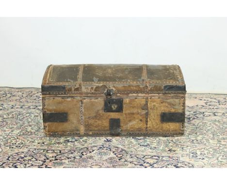 Late 18th century dome-top carriage trunk with mule skin covering and iron pin strapwork, with two side carrying handles and 