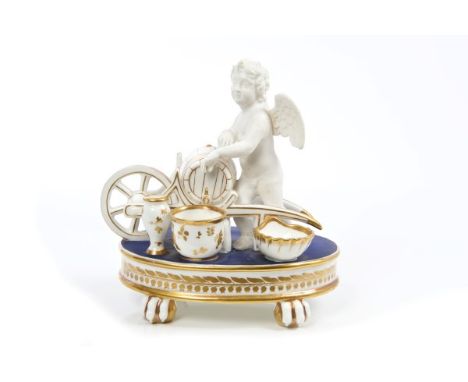 Good quality early 19th century French porcelain desk stand with bisque putto resting on a wine barrel mounted on a wheelbarr