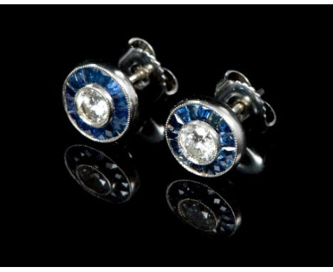 Pair diamond and sapphire 'target' cluster earrings, each centred with a brilliant cut diamond estimated to weigh 0.25 carats