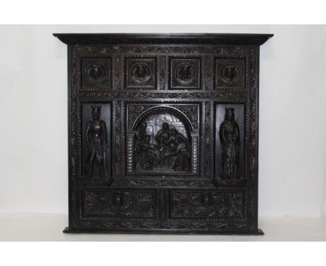 19th century carved oak panel with numerous sections carved in relief depicting medieval figures, 146cm high x 156cm wide