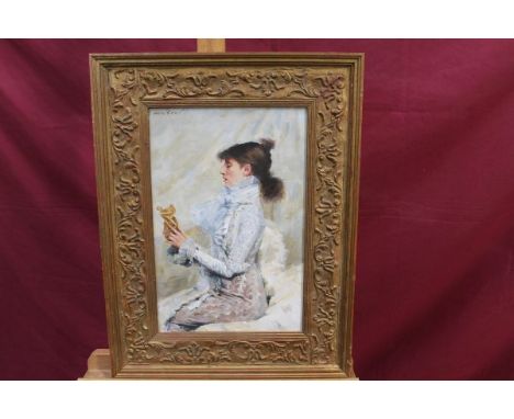 Paul Musin, 20th century oil on canvas laid on board - portrait of a lady examining a gilded object, signed, in gilt frame, 3