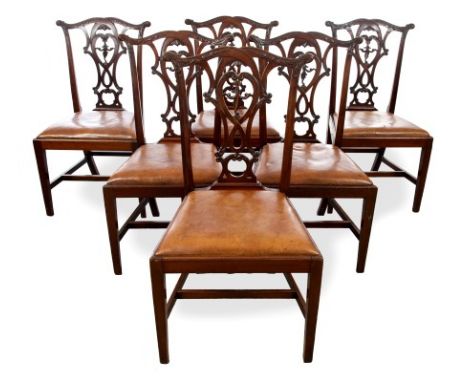 Set of eight Georgian-style Chippendale revival carved mahogany dining chairs with pierced splat backs, drop-in brown leather