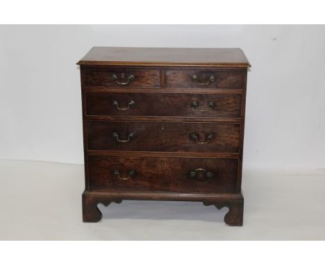 George III mahogany chest of two short and three long graduated drawers, with original brass swan-neck handles and cockbeaded