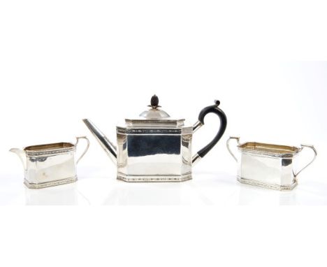 Fine quality 1920s silver three piece tea set comprising teapot of octagonal form, with bright cut floral borders, ebony scro