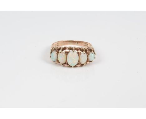 Edwardian gold opal five stone ring with five graduated oval cabochon opals in gold claw setting.  Ring size N½ CONDITION REP