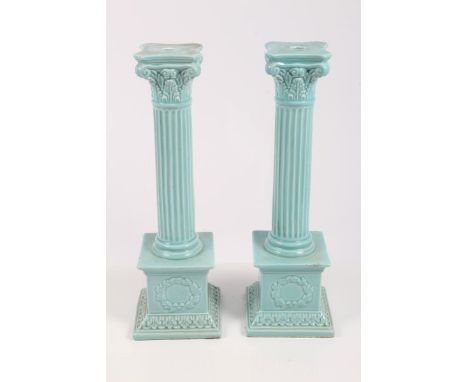 Pair of turquoise glazed pottery lamp bases, each modelled as Corinthian columns, with square bases, with laurel wreaths on s