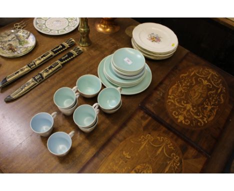 A collection of Poole twin tone teaware and floral decorated plates