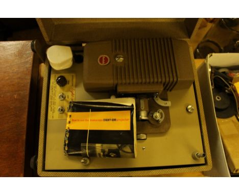 A Kodak projector - sold as collector's item; and box of various accessories etc.