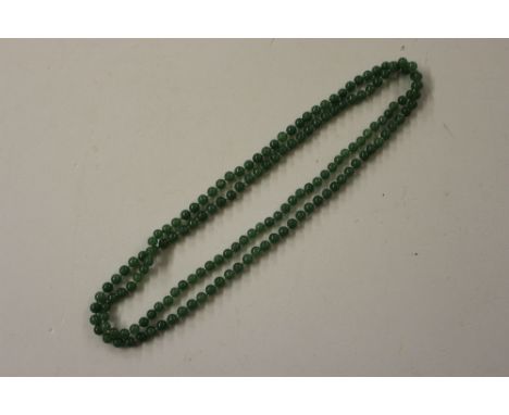 A jade coloured bead necklace 