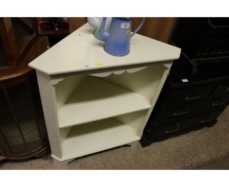 A white painted corner shelf unit