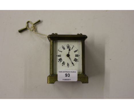 A small brass carriage clock with key 