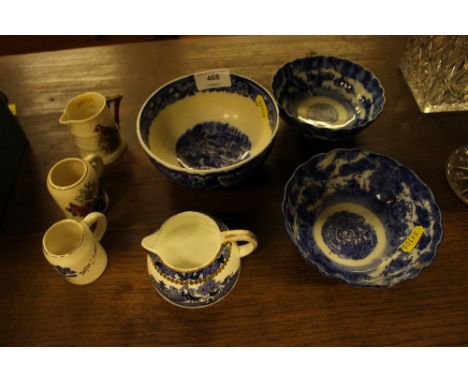 A Royal Worcester jug decorated with a goldfinch; two miniature tankards; a blue and white sugar bowl; a cream jug; and two o