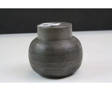 Pewter tea caddy of spherical reeded form, complete with interior lid and cover, height approximately 10cm