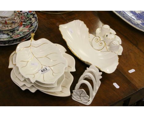 Quantity of Carltonware cream ground and gilt decoration, leaf dishes, toast rack, condiment set etc