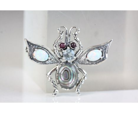 Silver bug brooch inset with opal panels and ruby eyes 