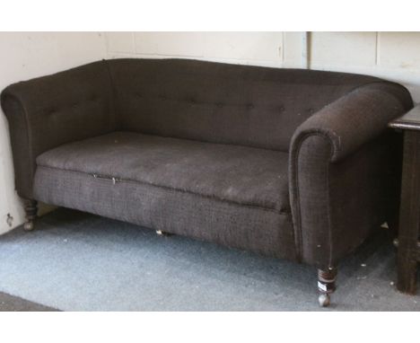 Victorian Chesterfield Sofa raised on turned legs with replacement castors, 173cms long x 82cms deep x 72cms high