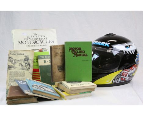 Shark full faced motorcycle helmet and a quantity of motorcycle books and booklets