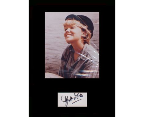 Hayley Mills Signature with young portrait. Professionally mounted in black to 16 x 12. Good condition Est. œ8 - 10