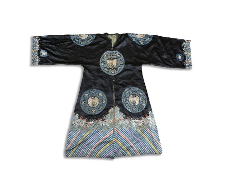 A FINE CHINESE KESI SILK COURT SURCOAT, Qing Dynasty, with centre front opening, the dark silk ground woven with two roundels