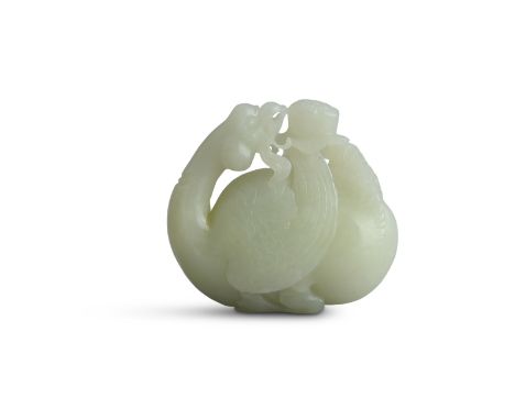 A CHINESE PALE JADE CARVING of mythical bird, modelled with returning glance and feeding on a flower head. 8.5cm wide 