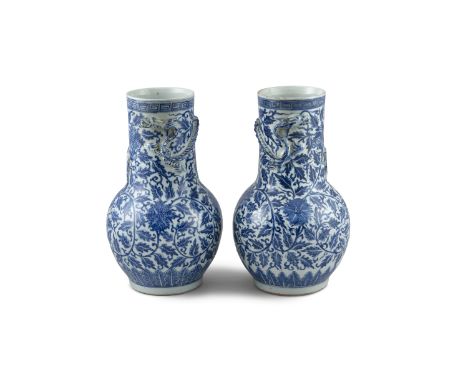 A FINE PAIR OF CHINESE BLUE AND WHITE BAULSTER VASES, 18th century, each with broadly potted necks applied with coiled dragon