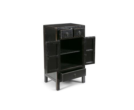 A CHINESE BLACK LACQUER COMMODE, of upright rectangular form, with two short drawers over a two-door cupboard section and lon