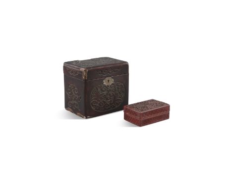 A CHINESE CINNABAR LACQUER TEA CADDY, 19th century, of rectangular form fitted with liner, 16cm wide; together with a rectang