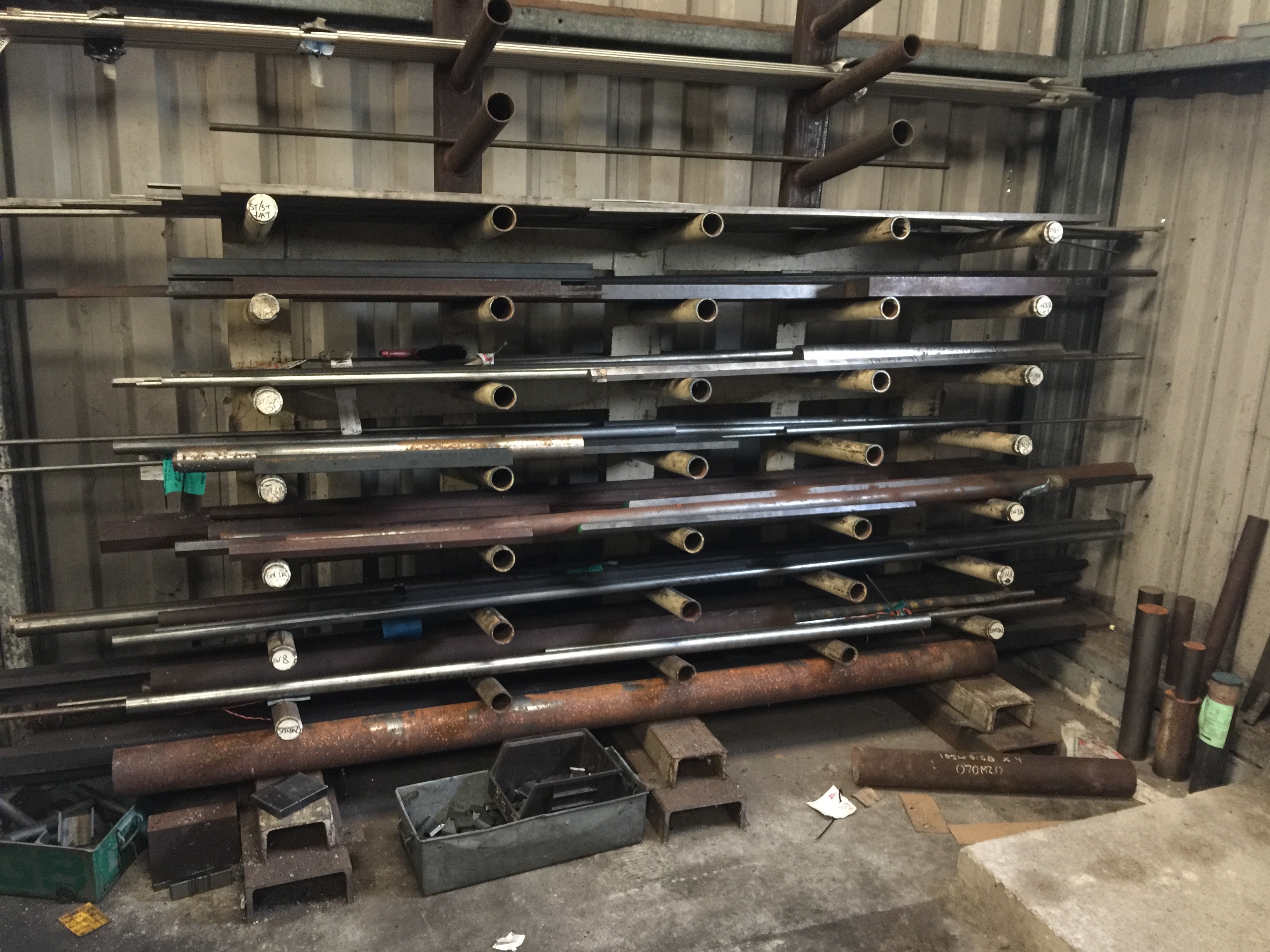 4 x Steel storage racks and contents stocks of round bar, tube, flat
