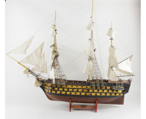 H.M.S. Victory. A detailed scale ship model of H.M.S. Victory, with three masts, hand painted, on a display stand, total heig