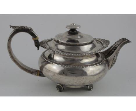 George III silver teapot hallmarked GH, London, 1817. Slight split to handle and has a few dents to the body. weight 25½ oz. 