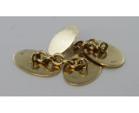 Pair of gents 18ct cufflinks with a plain oval design by Deakin & Francis Ltd. Weight approx 9.1g